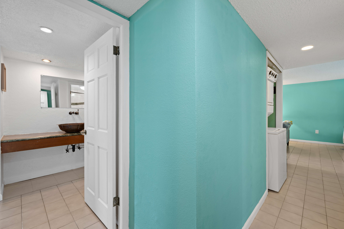 Convenient hallway leading to the bathroom and living spaces.