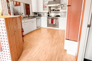 Kitchen fully stocked and appliances.