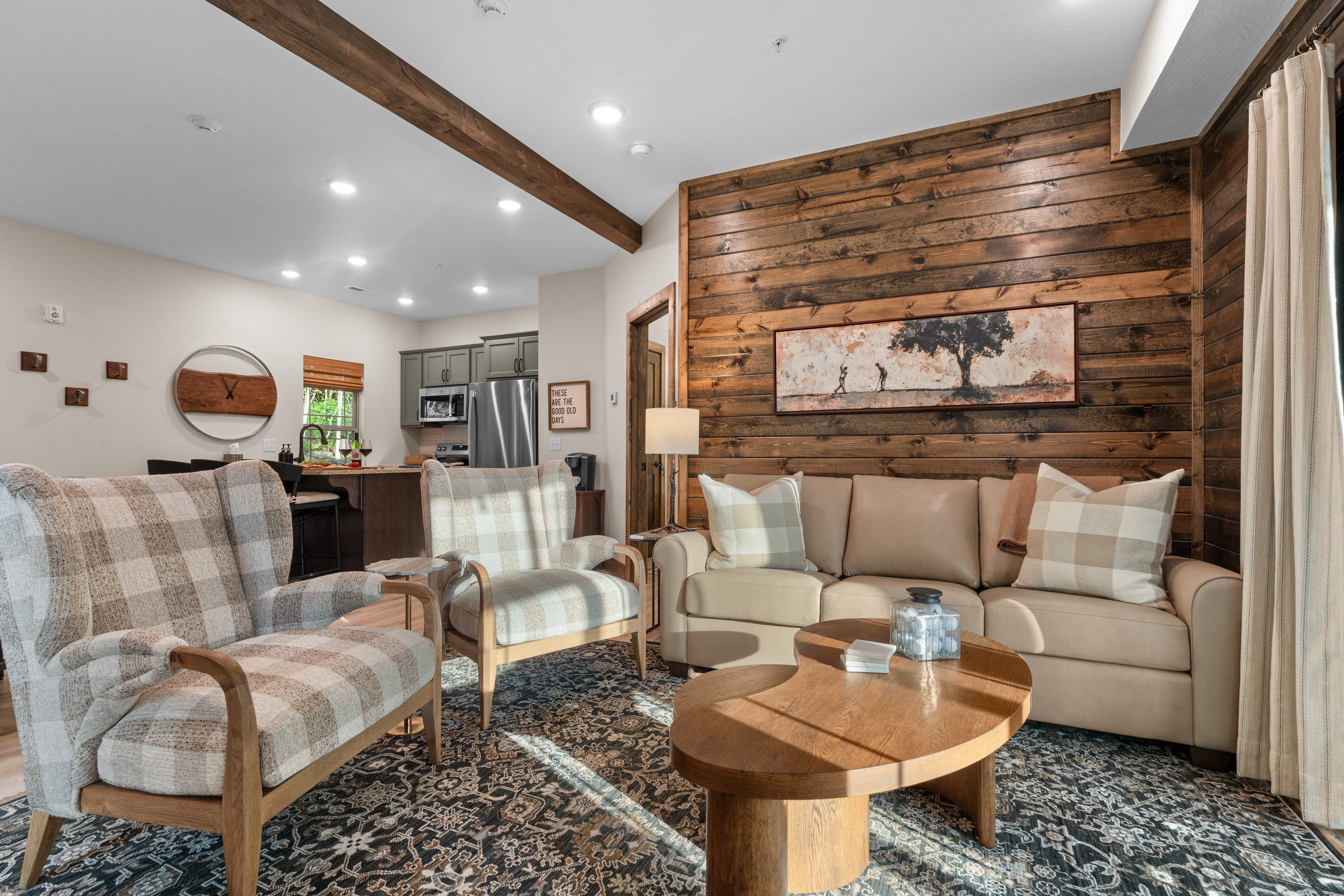 Sink into buffalo-check comfort with the golf-course art and a sunny slider to the deck.