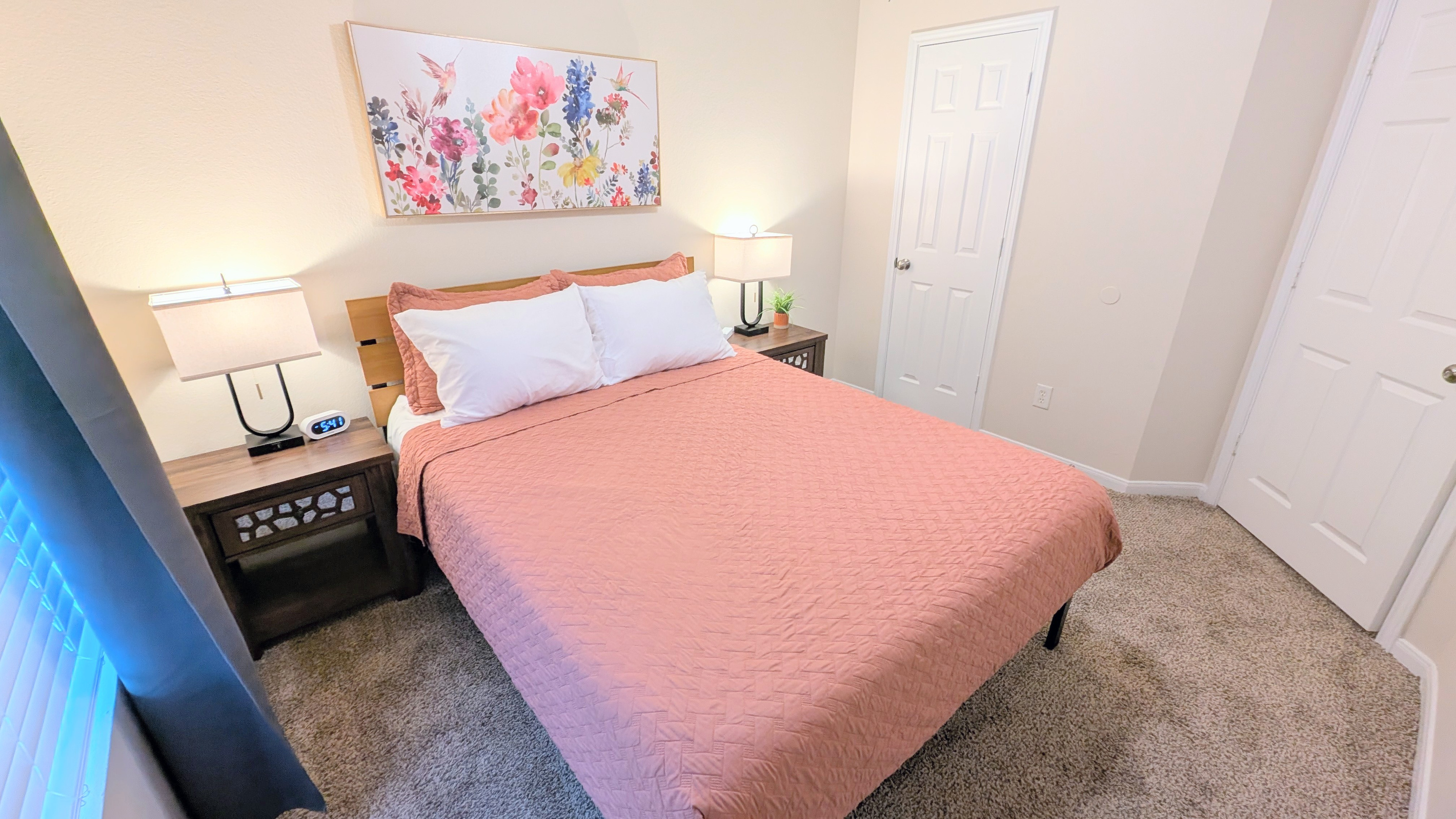 The queen bedroom has plenty of space in the closet for storage as well as hooks on the door. 