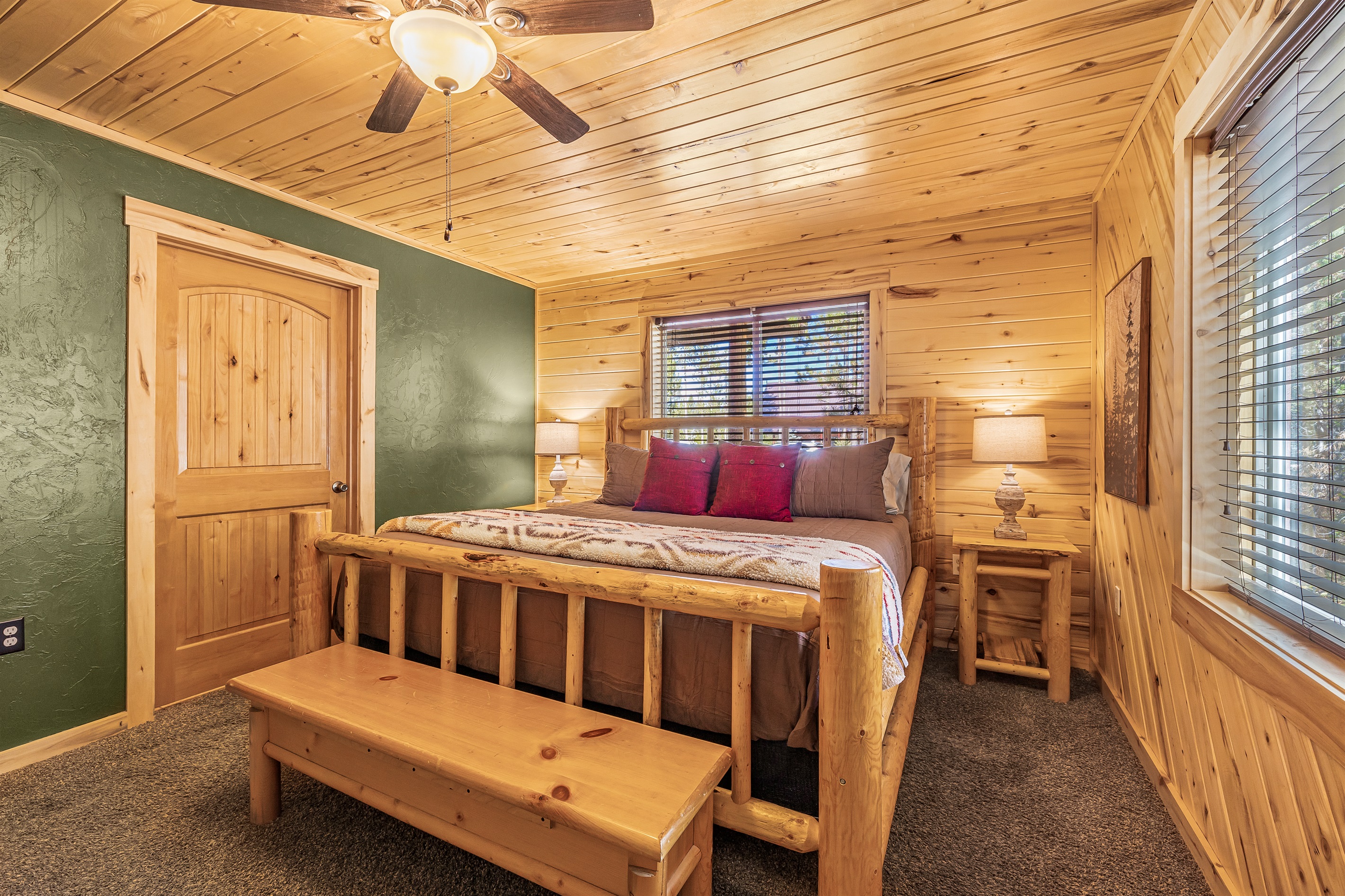 Master bedroom w/ king sized bed and private ensuite bathroom