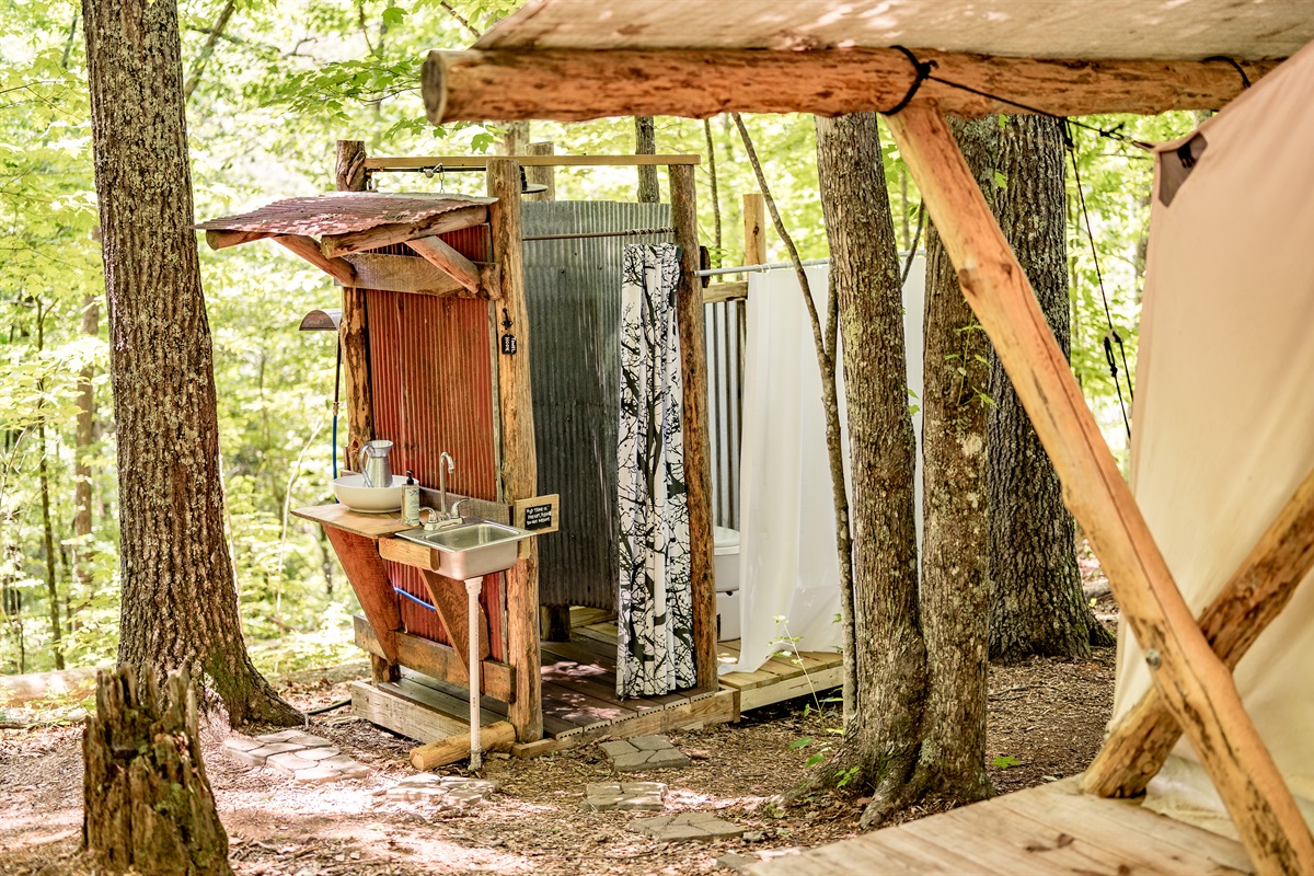 Shower and sink outside of tent for glampers to use.