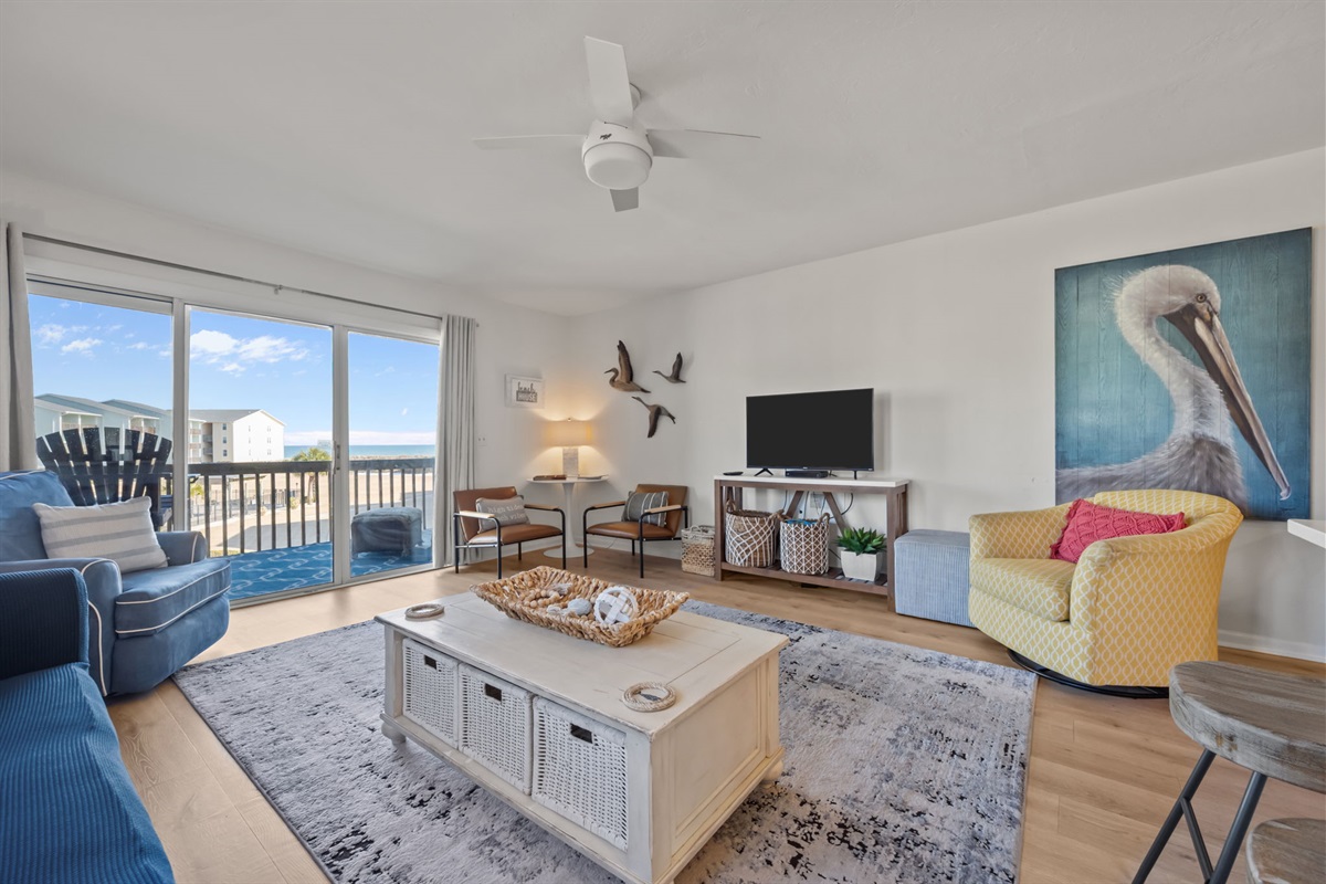 Cozy coastal living room with balcony access