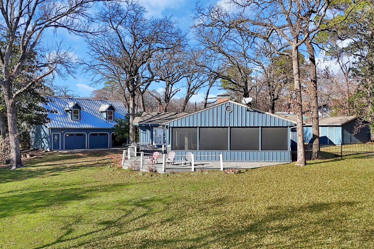 A wide, open yard with water views and plenty of space to roam and relax.