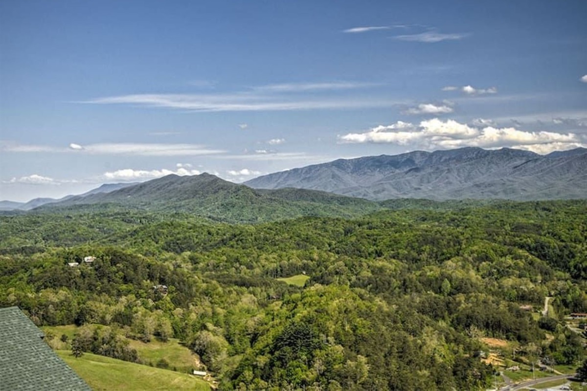 - Expansive daylight view of the Smoky Mountains and lush forest valleys   - Gaze across endless greenery and bright skies from your private balcony   - Nature&rsquo;s beauty unfolds in every direction with serene mountain calm