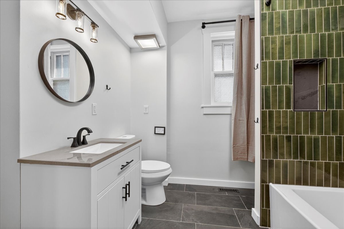 Newly remodeled bathroom with tub on the main floor.