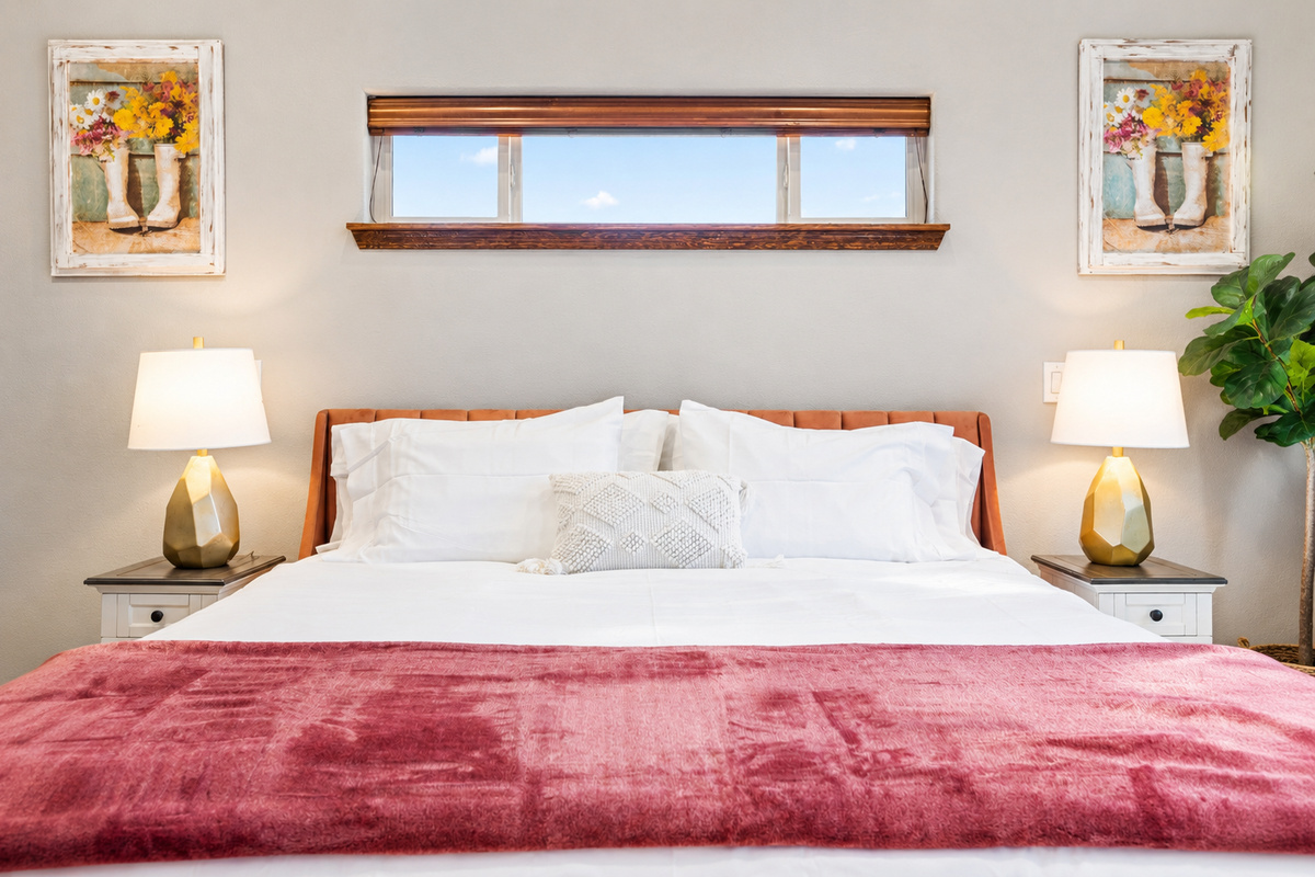 Escape to pure comfort in our mainfloor master bedroom. Sink into the embrace of premium linens atop a king bed, where tranquility meets luxury. With modern amenities and serene views from the patio, your stay promises relaxation and indulgence.