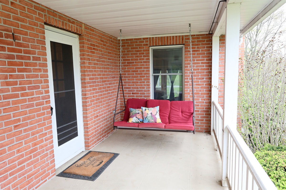 Our front porch includes a swing - take in all seasons while gently swinging