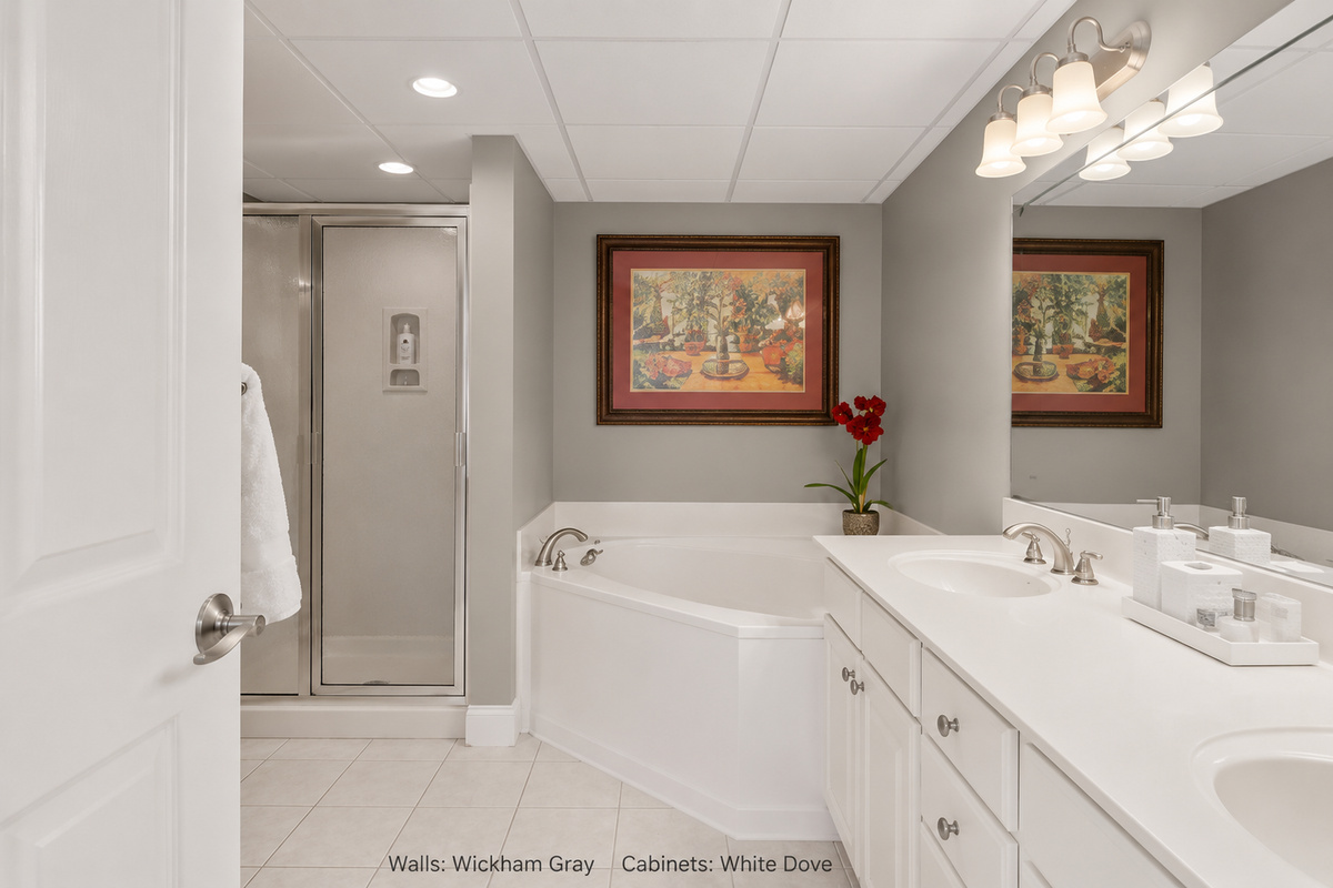Master bathroom soaking tub and double sink vanity.
