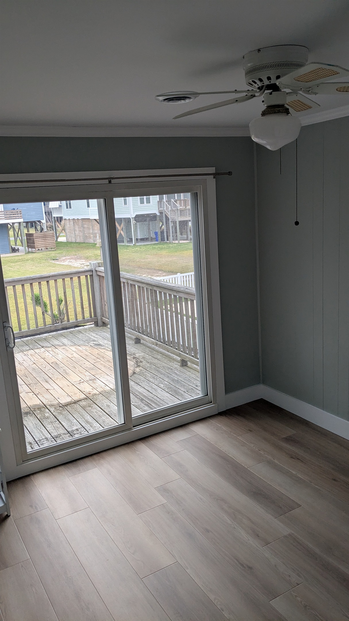 Bedroom will soon have a queen bed, nightstands and dresser with sliding doors on to the back deck. This room connects to the large bathroom with a tub.