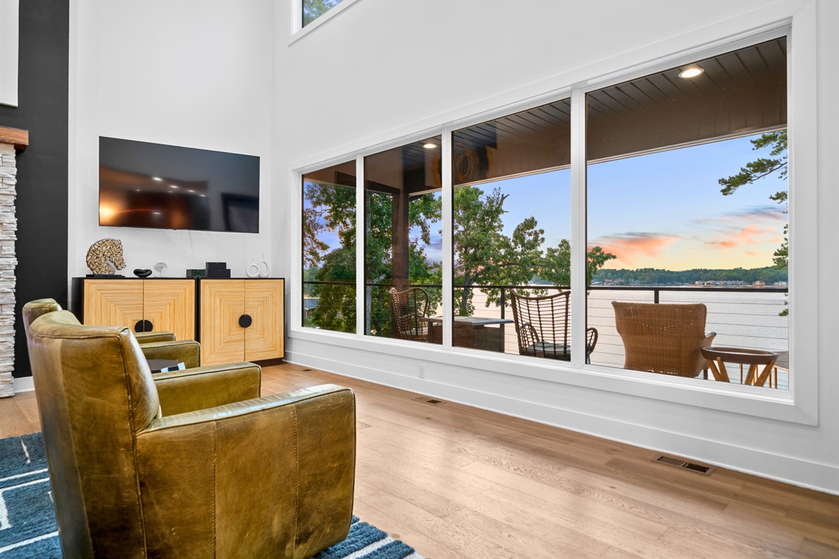 Lake views from the living room bring the outdoors in with effortless style.