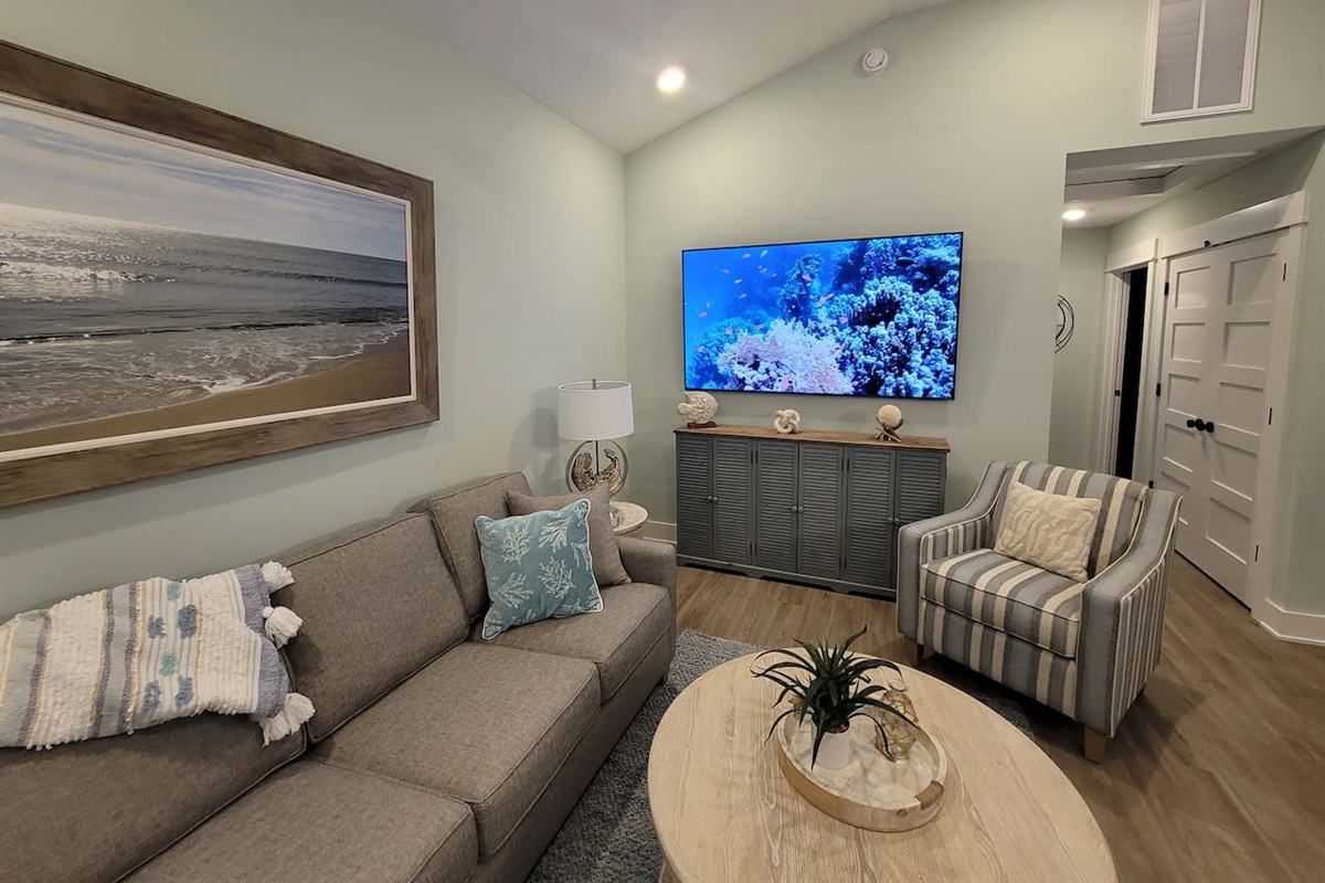 Large 75 inch Smart TV with HDMI jacks for easy gaming connections.  