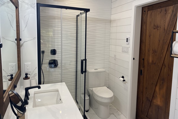 The ensuite bathroom has full shower as well as bath tub for your use