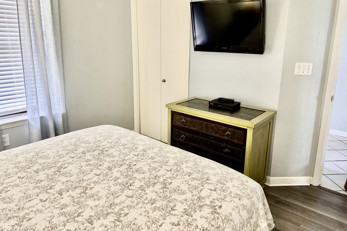 Our queen bedroom has a nice wall mounted tv to enjoy and lots of storage!