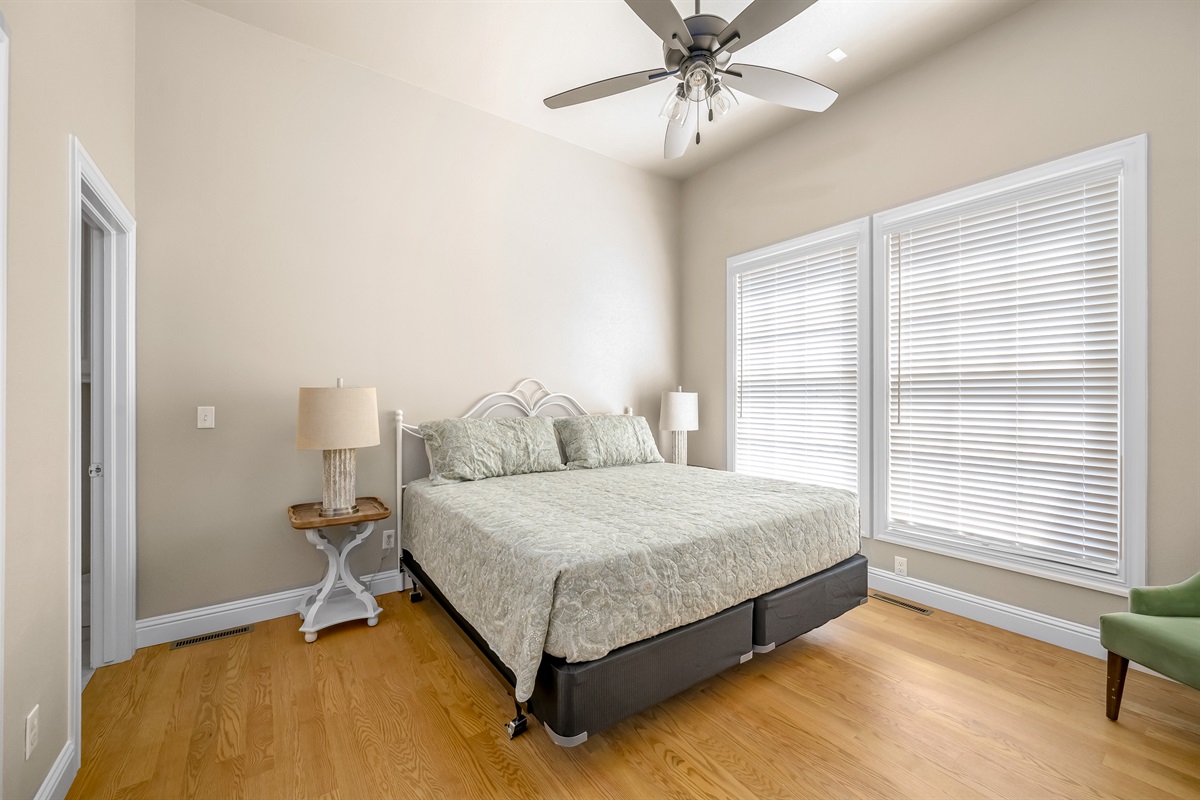 Main level king #1 with ensuite bathroom. There are 2 steps down to this bedroom from the kitchen area.