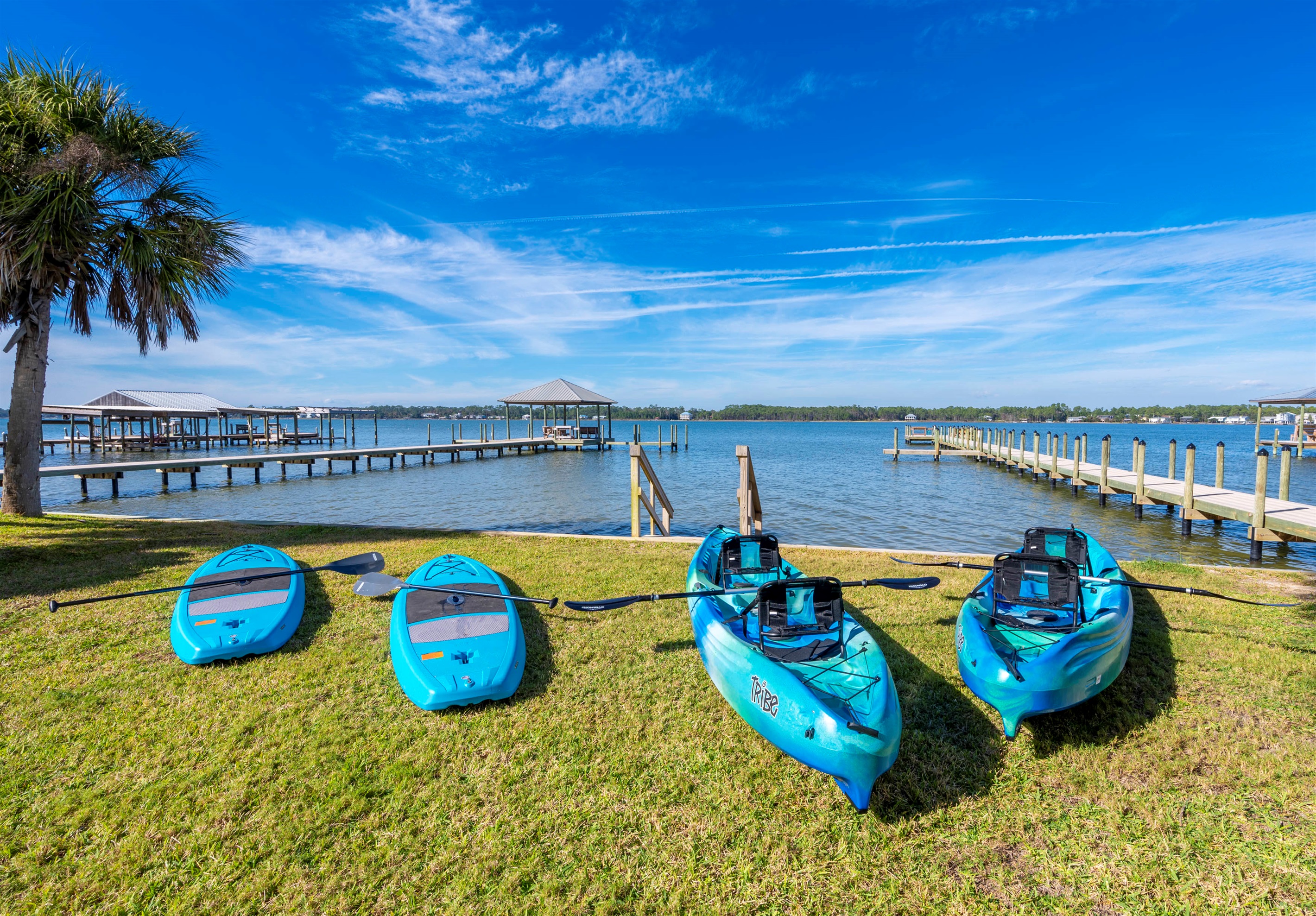 The waterfront retreat offers 2 tandem kayaks, 2 paddleboards, and serene views—perfect for adventure.