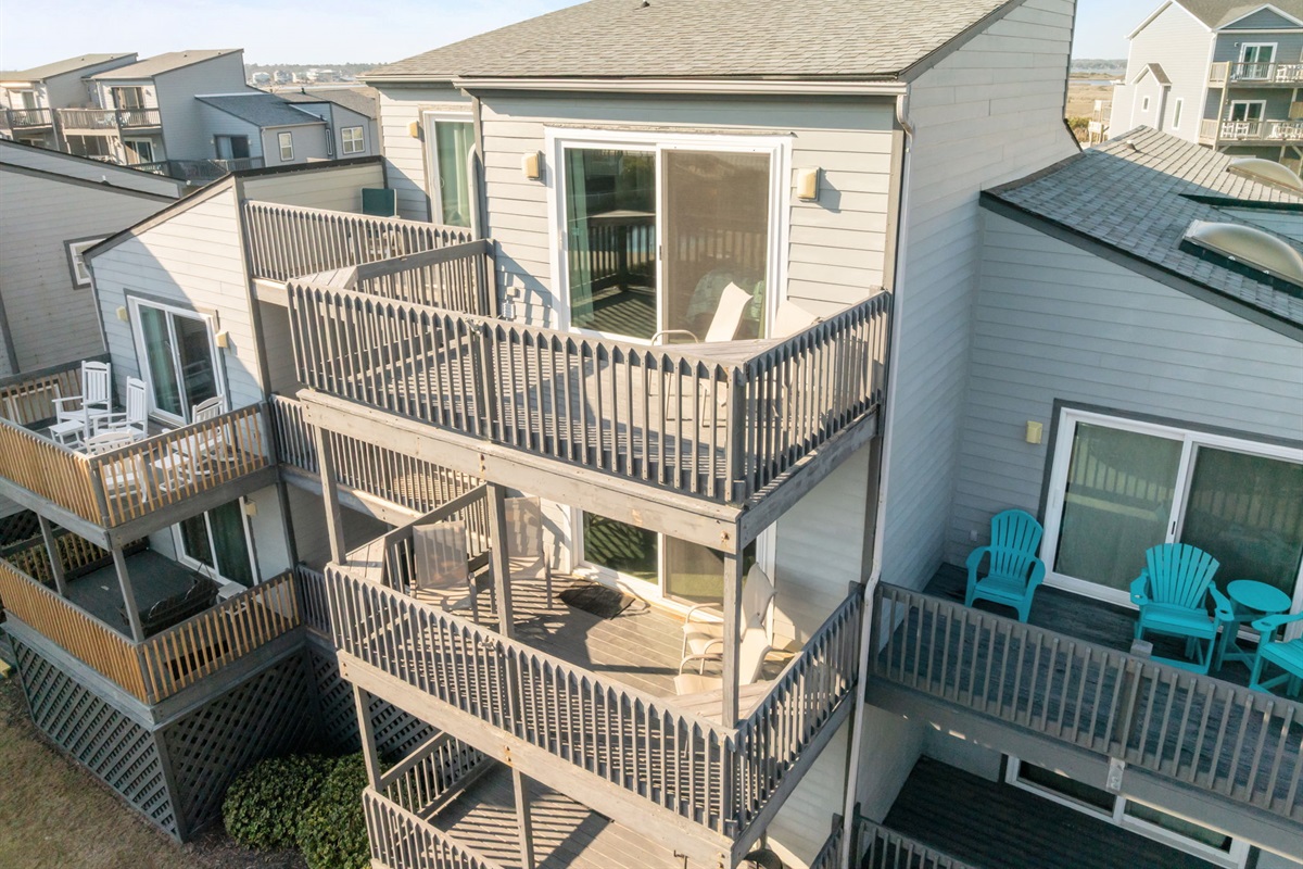 Elevated exterior perspective highlighting the multi-level coastal architecture and spacious decks