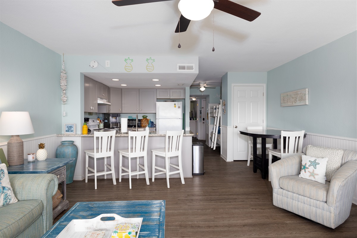 Breakfast bar, dining table, and cozy seating for effortless vacation living