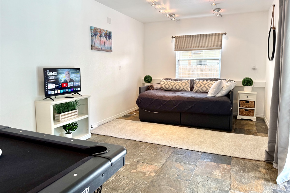 This bonus bedroom doubles as a game room — perfect for entertaining.