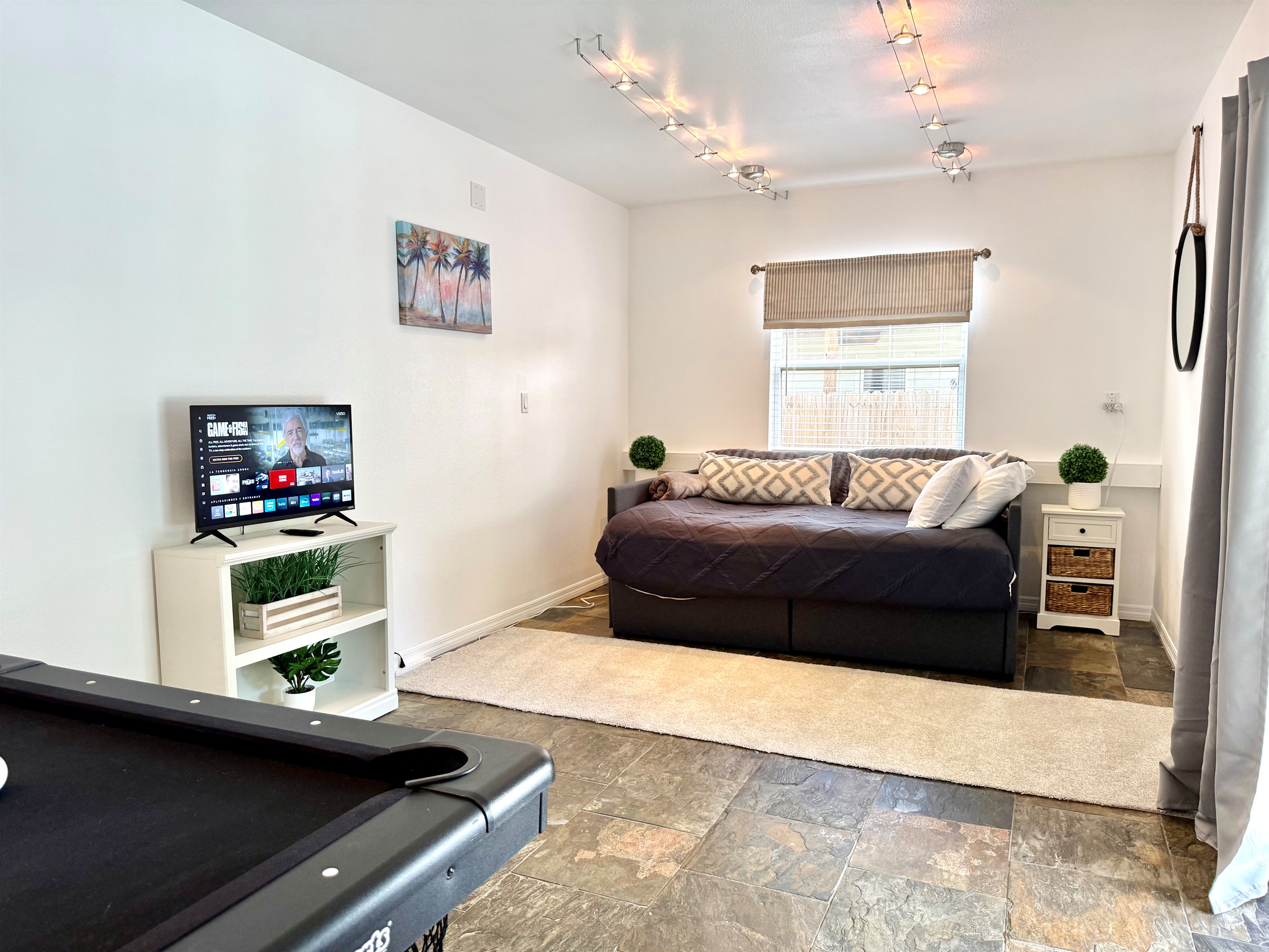 This bonus bedroom doubles as a game room — perfect for entertaining.