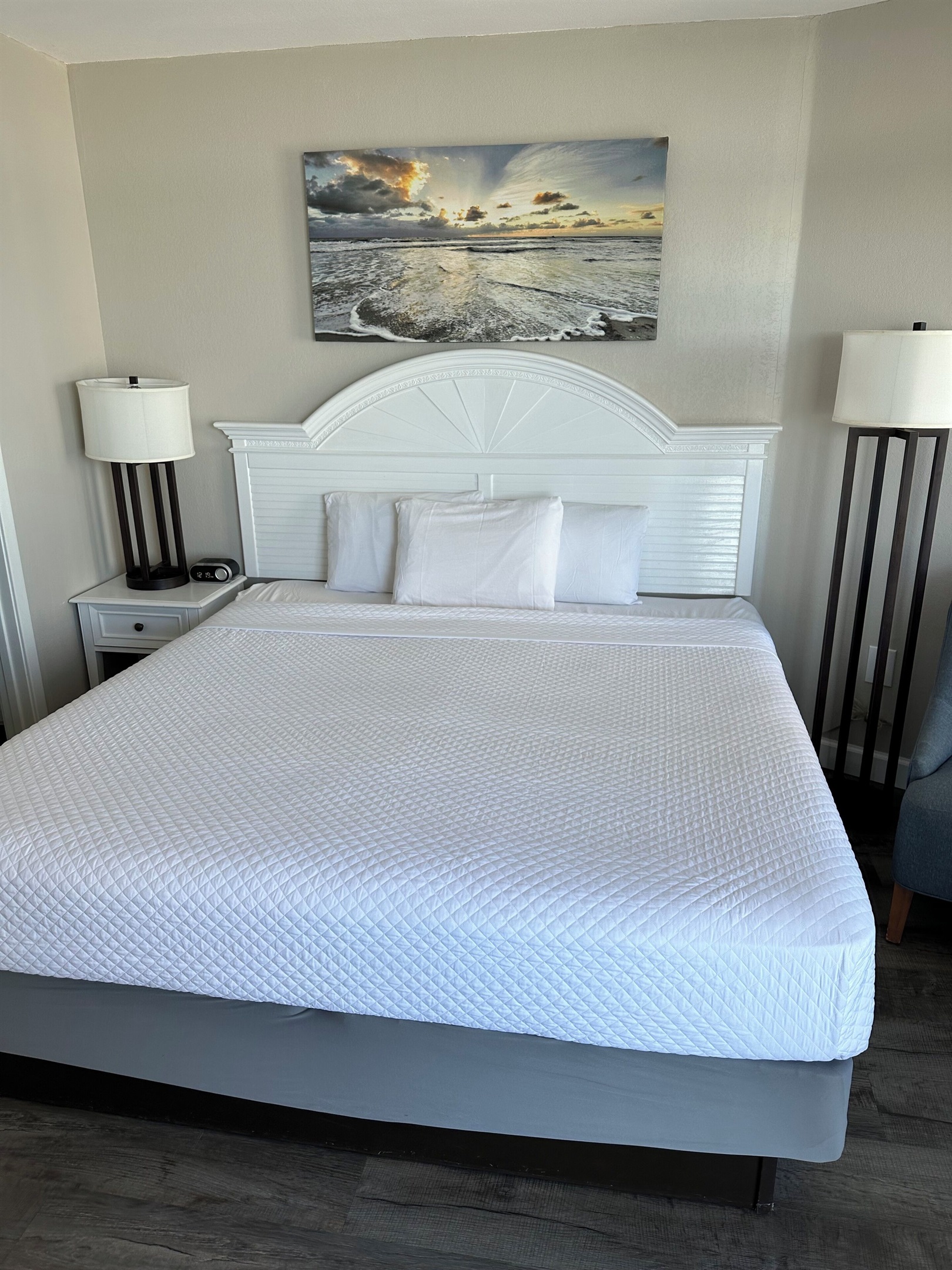 The Master Bedroom features & a stunning oceanfront view with balcony access.