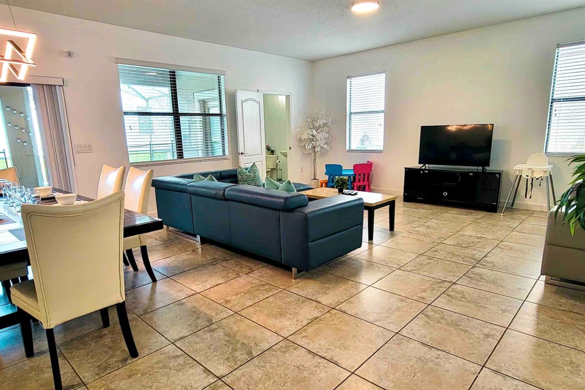 Living room,  the highchair and the kids table and the bathroom for the living room and outside