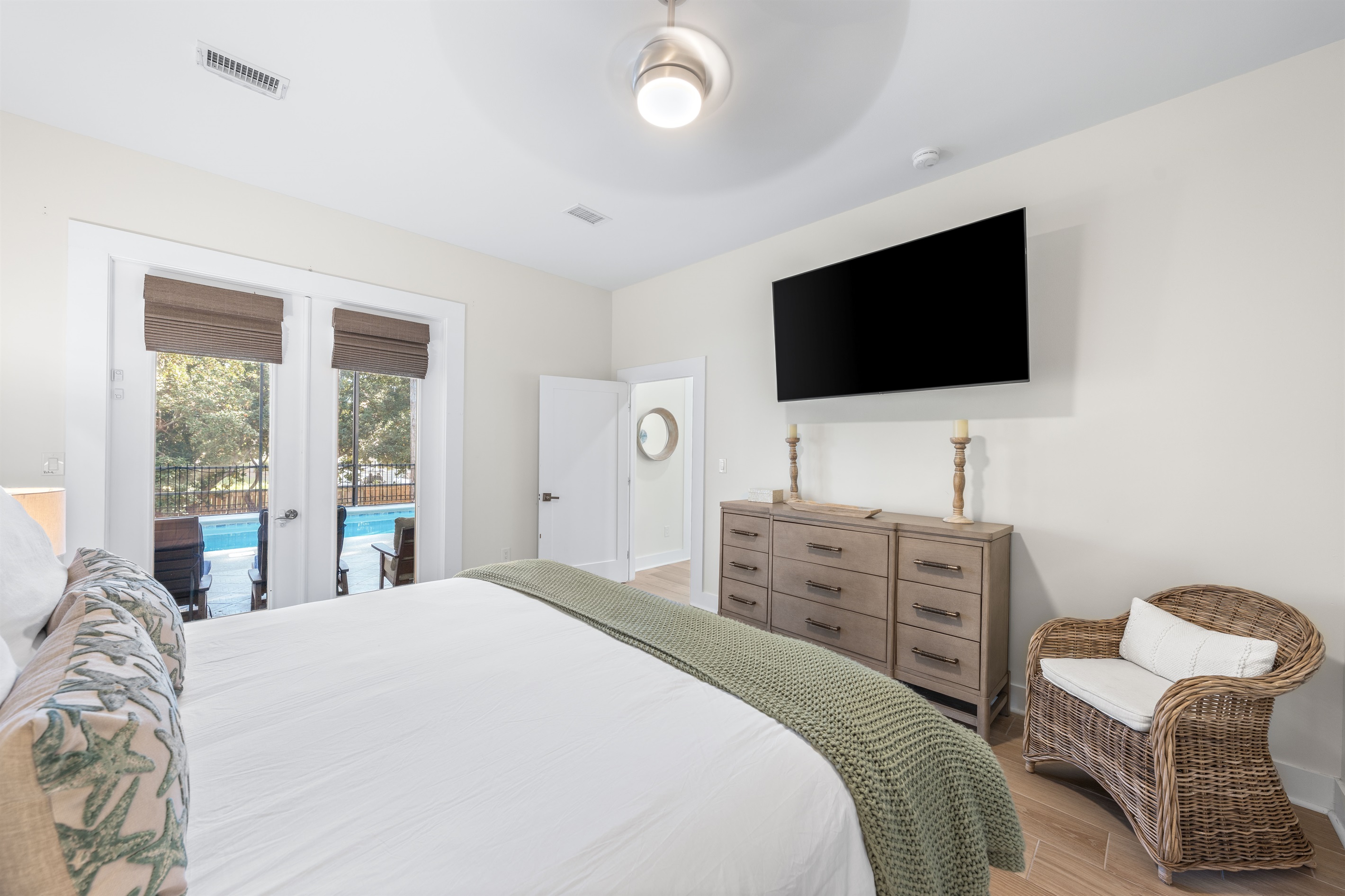 Primary suite with french doors to pool area.