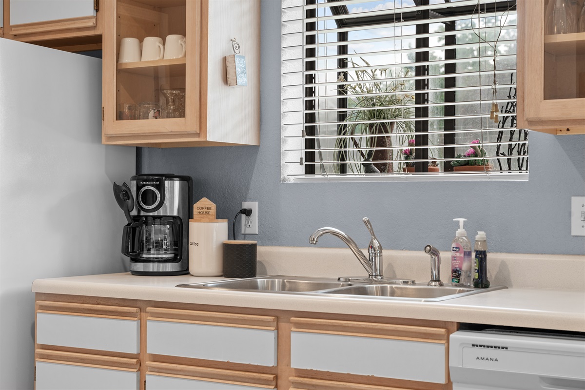 Small practical touches in the kitchen help the condo feel ready for an actual stay.