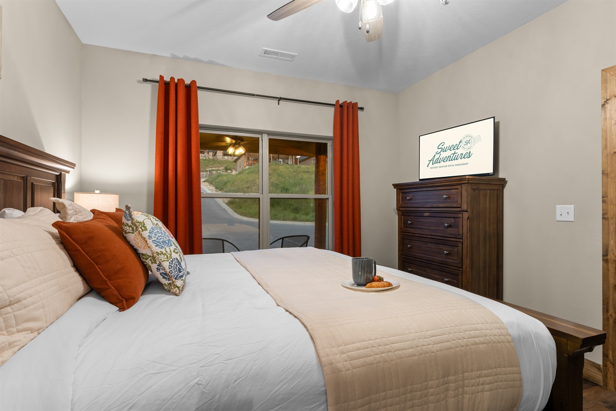 Cozy downstairs king bedroom with luxury linens and easy first-floor access.