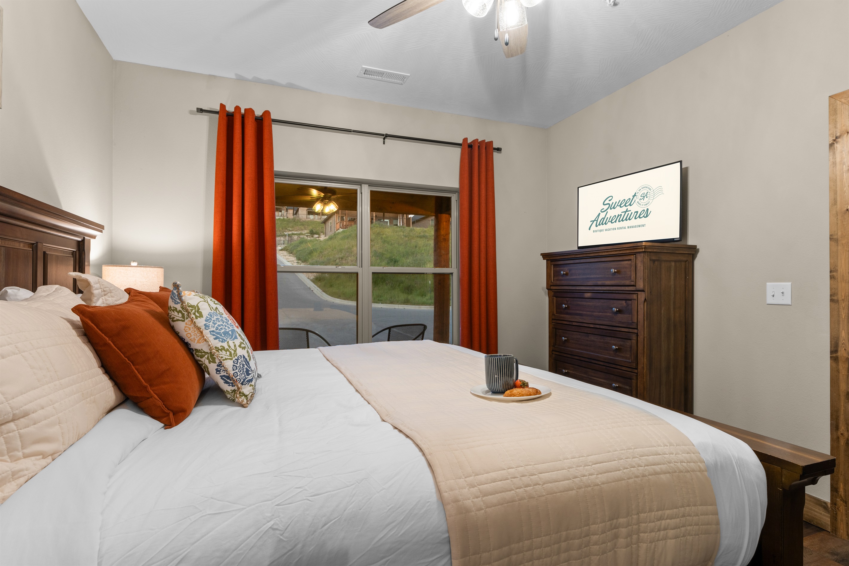 Cozy downstairs king bedroom with luxury linens and easy first-floor access.