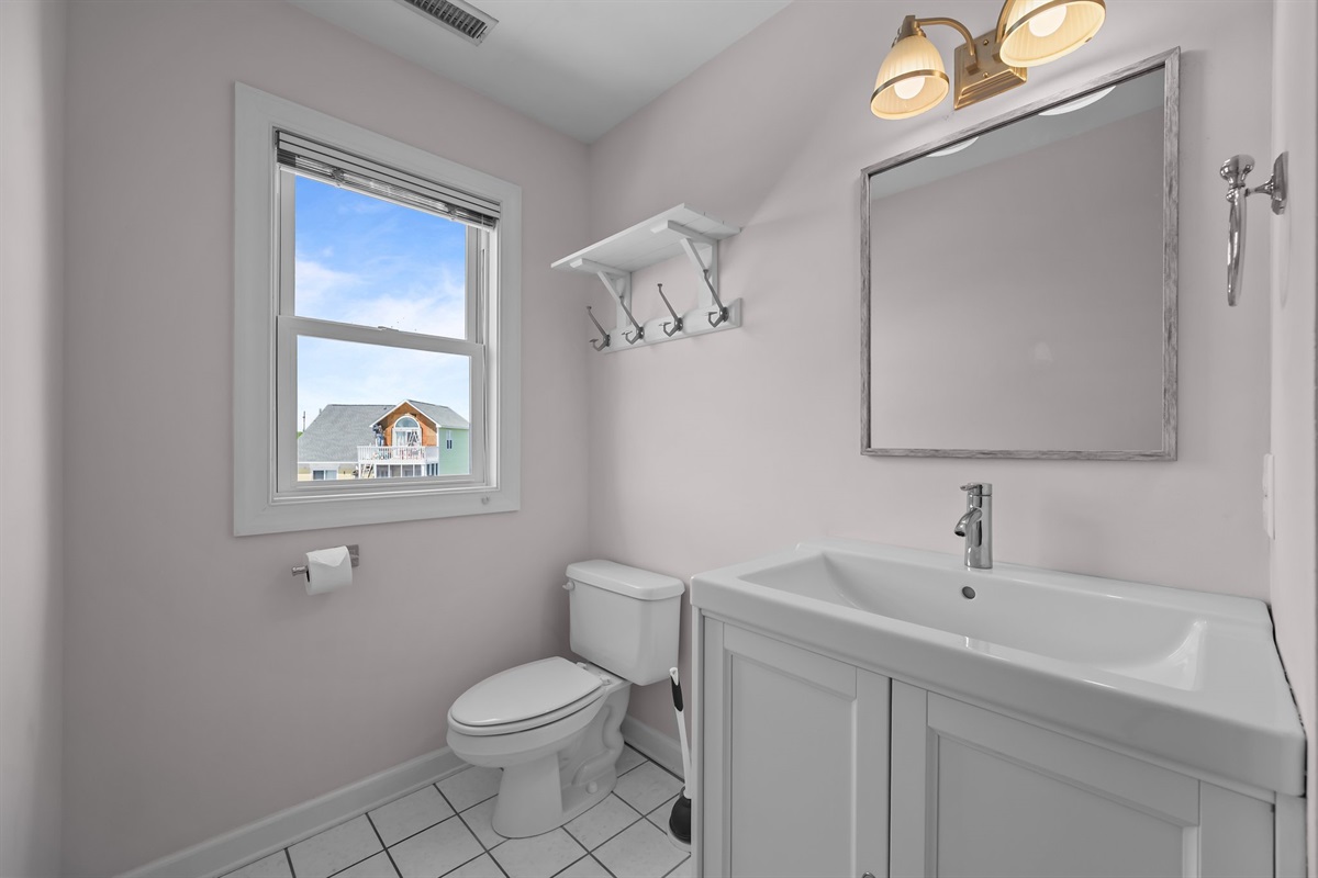 Light-gray walls and white tiles create a serene atmosphere in this bathroom.
