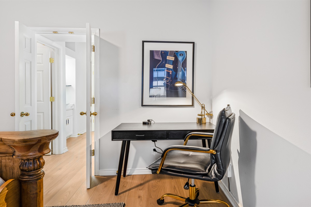 Get inspired in this stylish workspace in the primary bedroom! With a sleek desk, a comfy chair, and a touch of artistic flair, it's perfect for tackling work or just jotting down thoughts. Whether you’re on duty or off, this corner’s got you covered