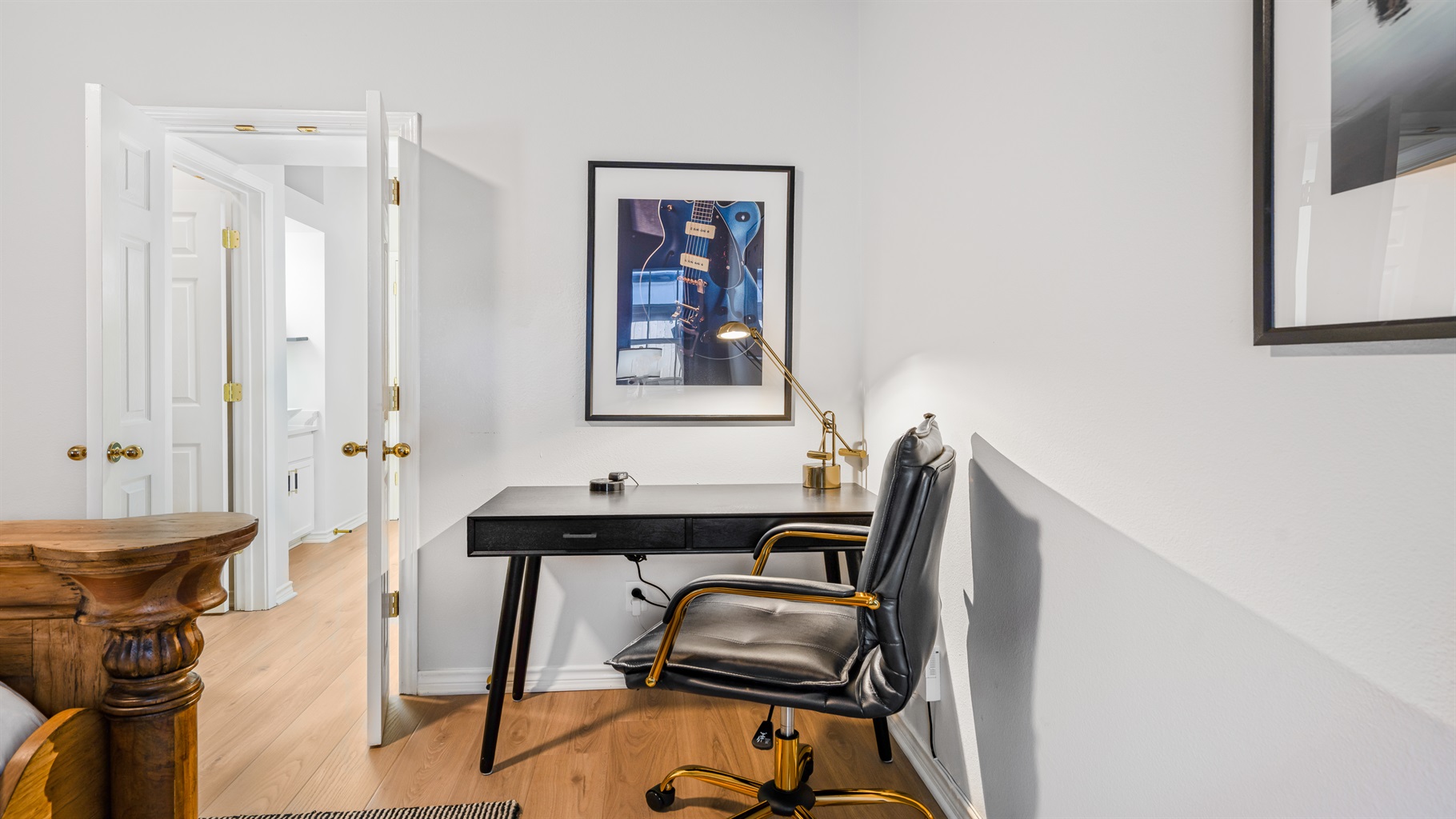 Get inspired in this stylish workspace in the primary bedroom! With a sleek desk, a comfy chair, and a touch of artistic flair, it's perfect for tackling work or just jotting down thoughts. Whether you’re on duty or off, this corner’s got you covered