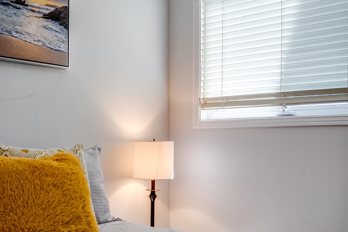 A Queen bedroom with serene primary suite with full lake exposure