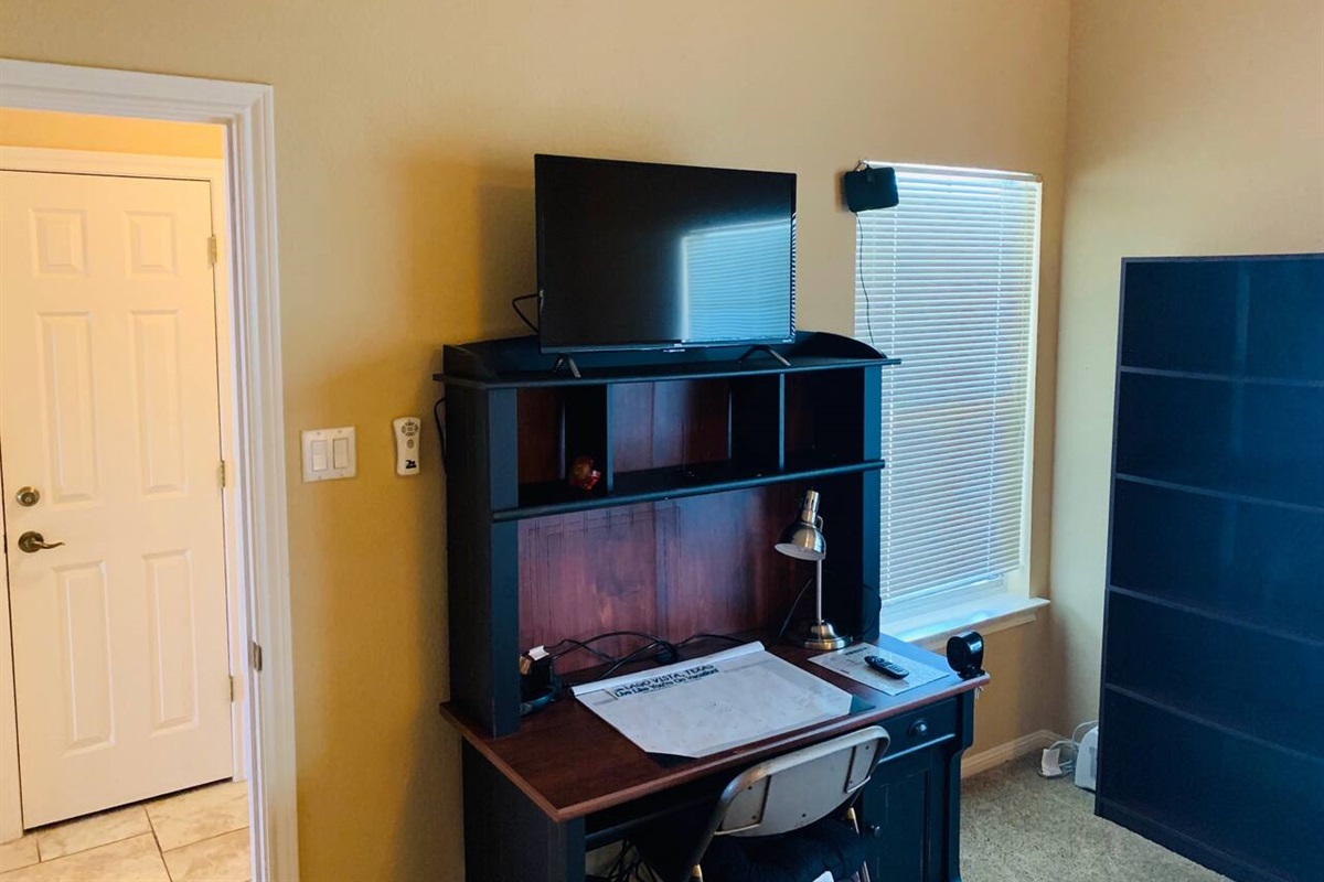 Smart HDTV & Study Desk in Guest Bedroom