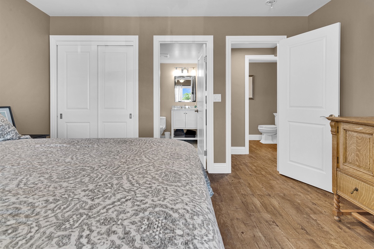 Queen size bed on main floor with its own bathroom