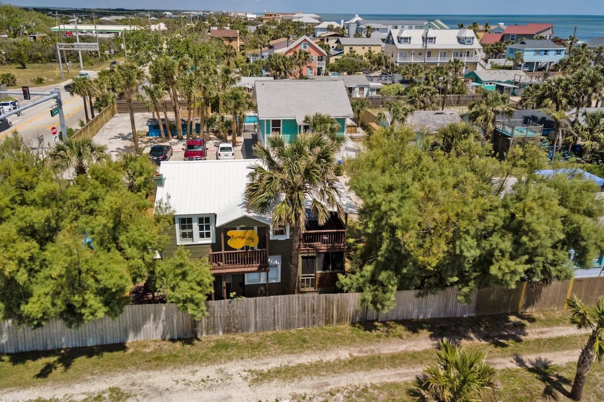 An aerial over the neighbourhood, all quiet lanes, mature palms and low beach houses. This is a residential pocket rather than a resort strip, which is very much the whole point of choosing to stay here.