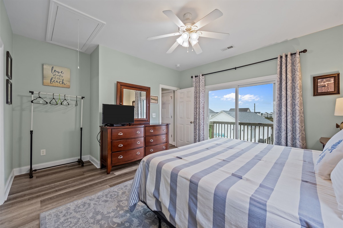 Master bedroom features sound side balcony access