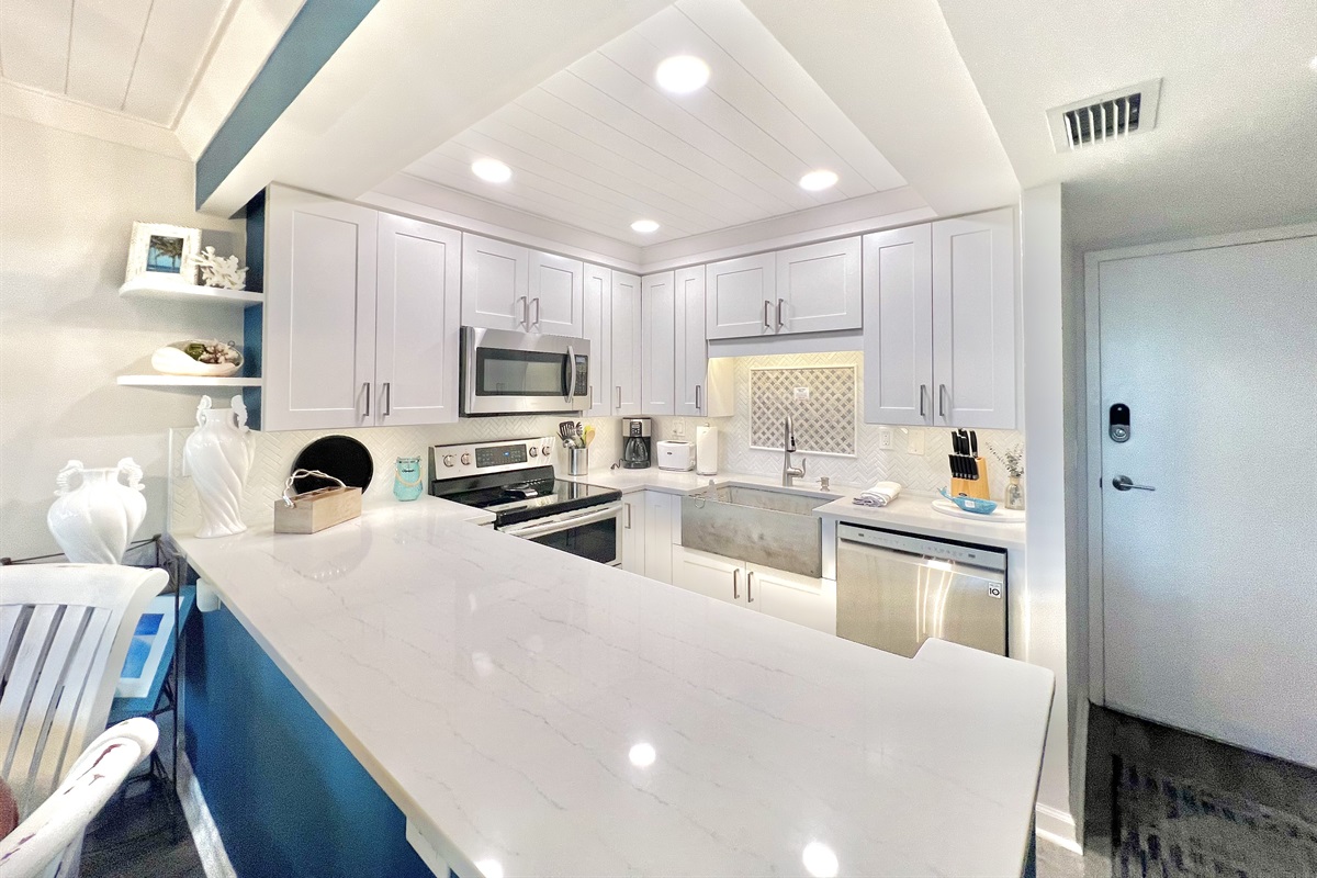Sleek, modern kitchen with quartz countertops – fully equipped for vacation cooking.