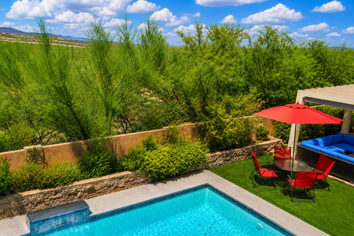 Relax and unwind in the private backyard and sparkling pool. No neighbors behind you.
