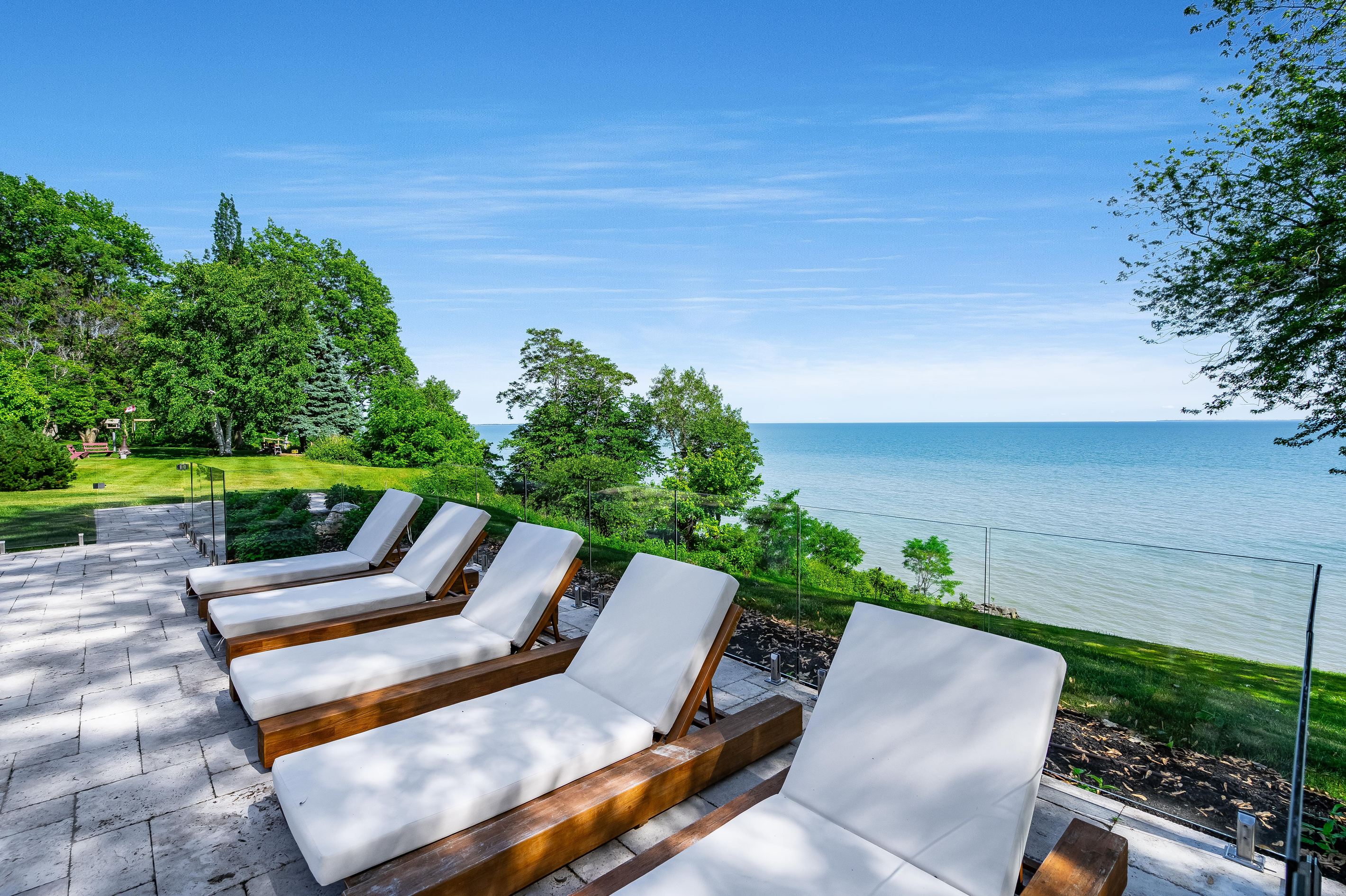 Enjoy peaceful, poolside moments from the lounge chairs. 