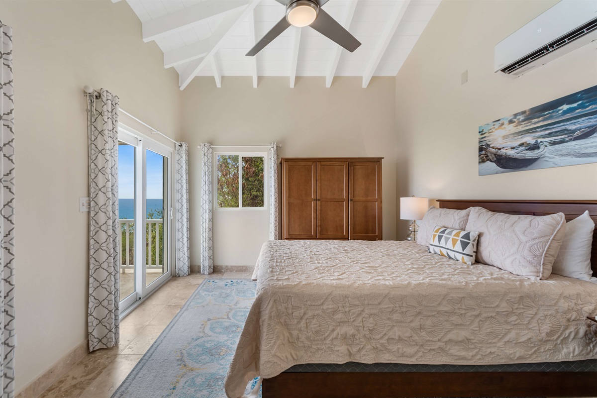 Main floor queen bedroom combines comfort and style effortlessly.