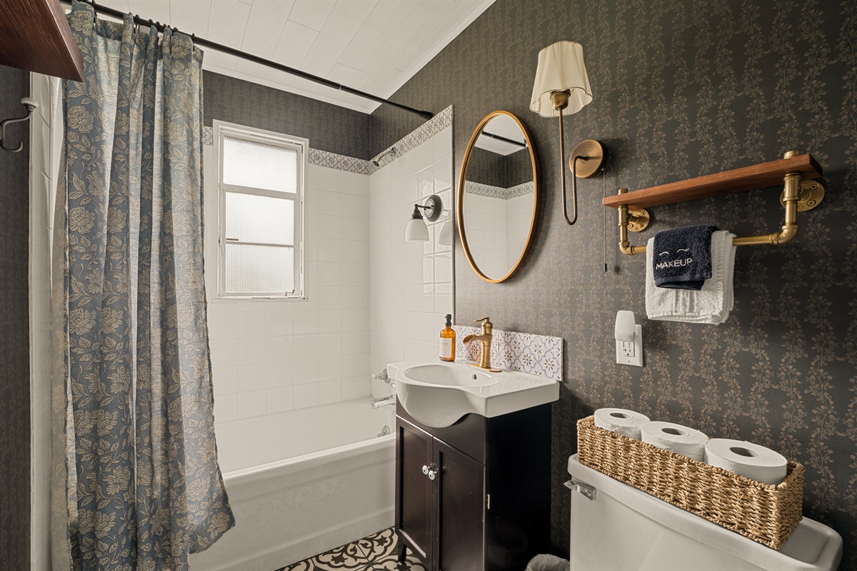 Classic charm with a cozy, elevated feel in the top level bathroom.