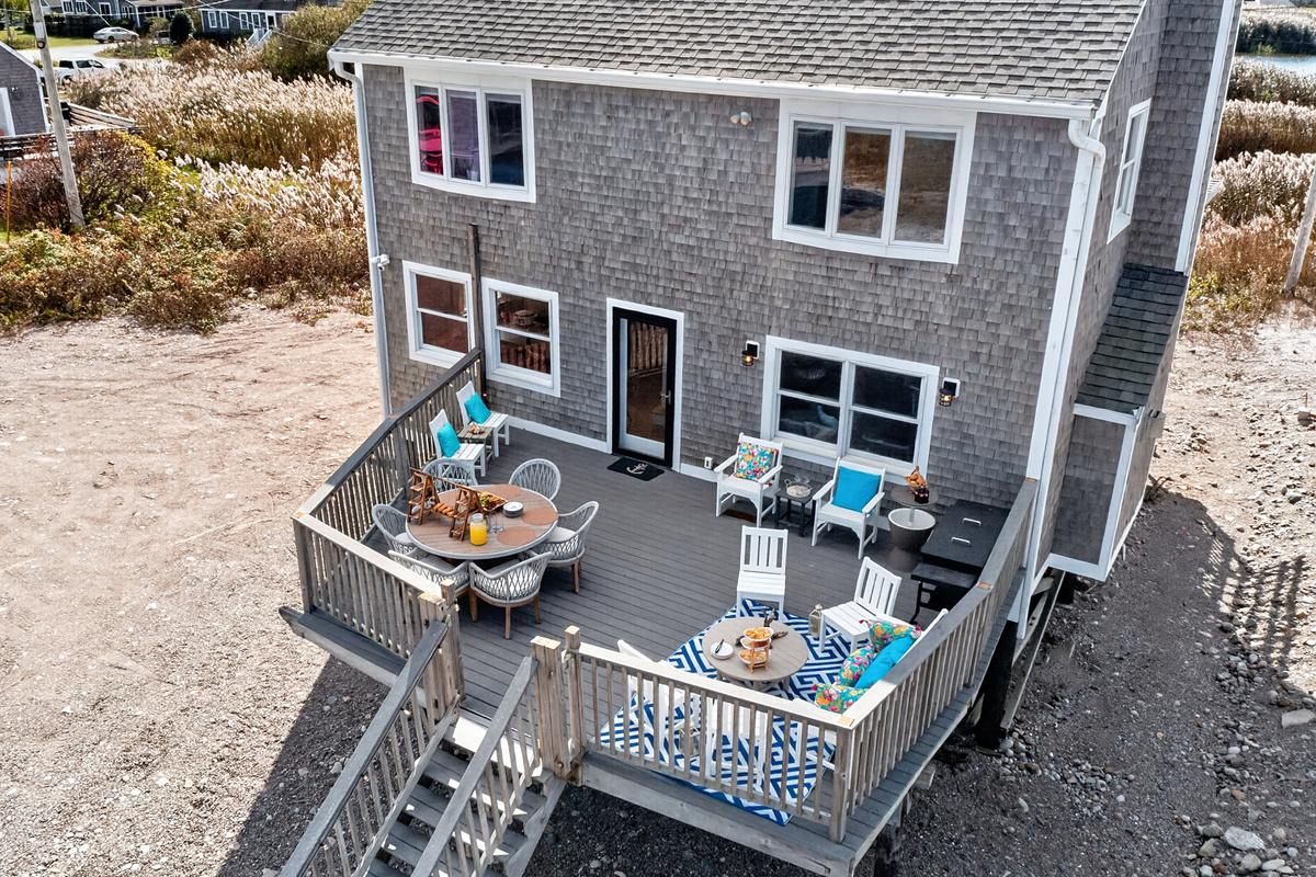 Spacious deck perfect for enjoying outdoor meals and the fresh air.