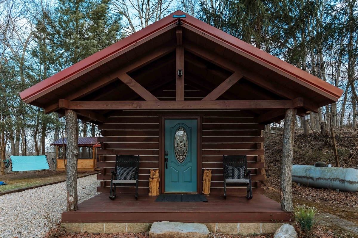 A welcoming timber-framed entry to your private hillside retreat.