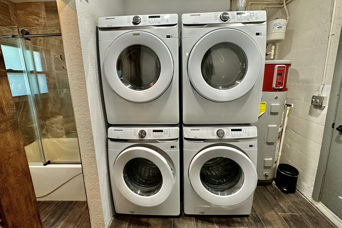 Dual stacked washers/dryers allow for quick cleanup after the beach.