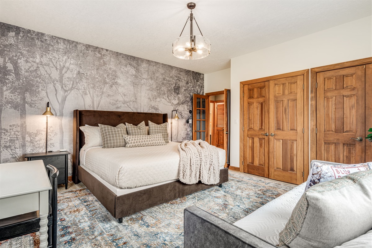 The Biltmore bedroom with king bed and day bed trundle has plenty of closet storage, which happens to be file cabinet deep - a nod to the professor who custom designed this home.