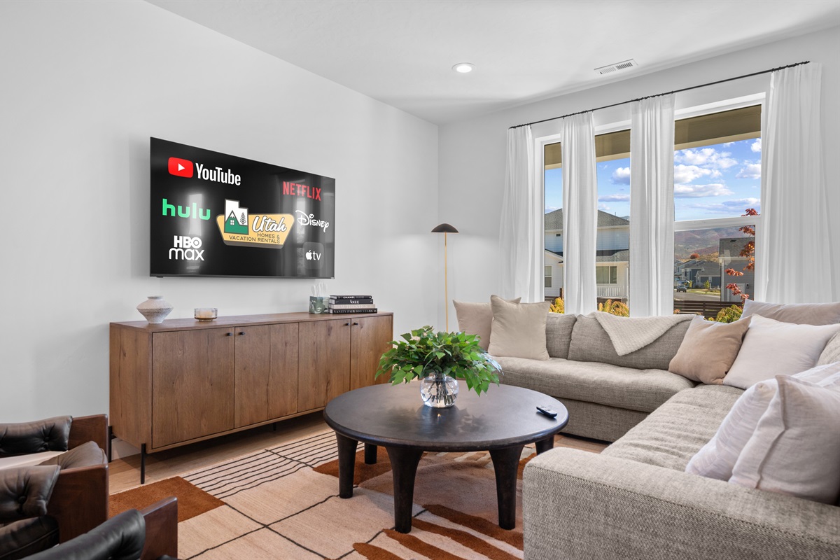 Sink into the oversized sofa, sip a warm drink, and watch the sunset over the mountains.