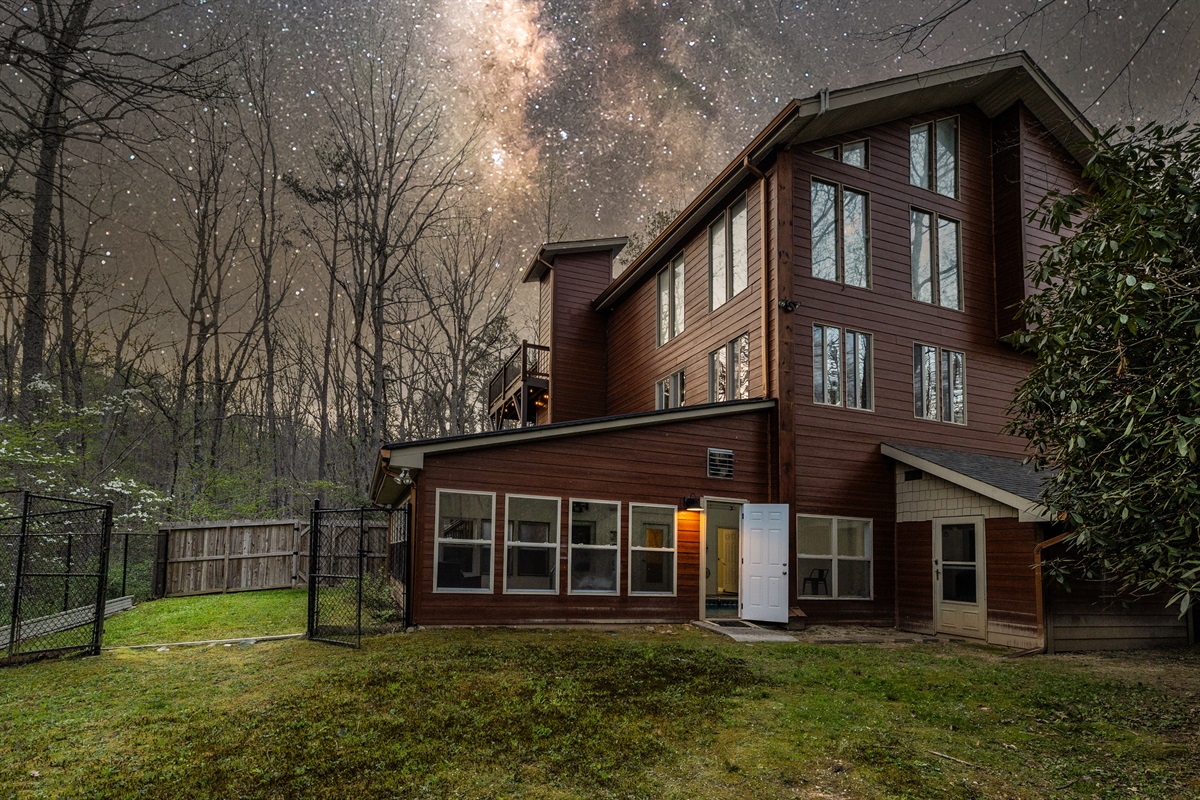 View of house showing indoor pool and fenced in back yard