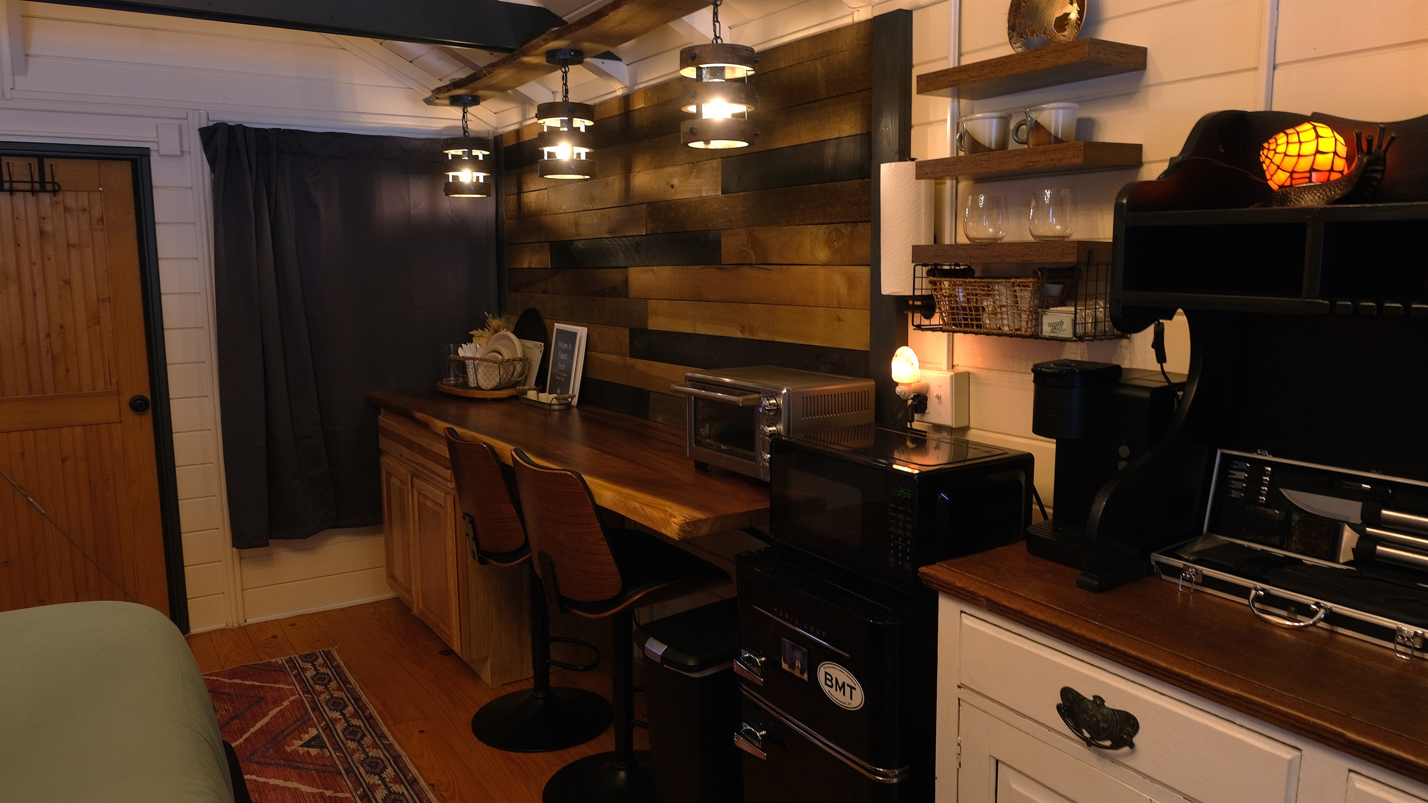 Kitchenette with minifridge, microwave, and Keurig.
